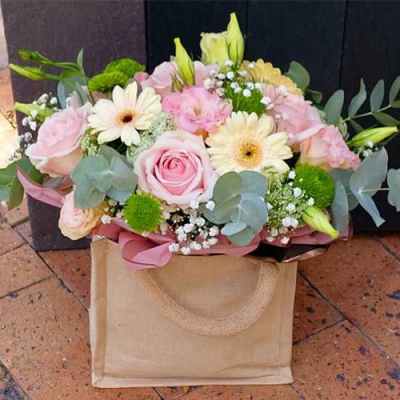 Hug n Kisses - A delightful handtied bouquet created using pale pink roses, green and white flowers with complimentary foliage. Hand delivered with care in and around Cape Town by Shirleys Flower Designs.